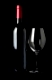 Flasche Rotwein und ein Weinglas isoliert vor schwarzem Hintergrund - Bottle of red wine and a wine glass isolated on black background
